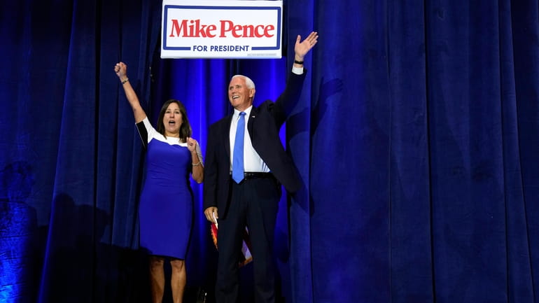 Republican presidential candidate former Vice President Mike Pence and his...