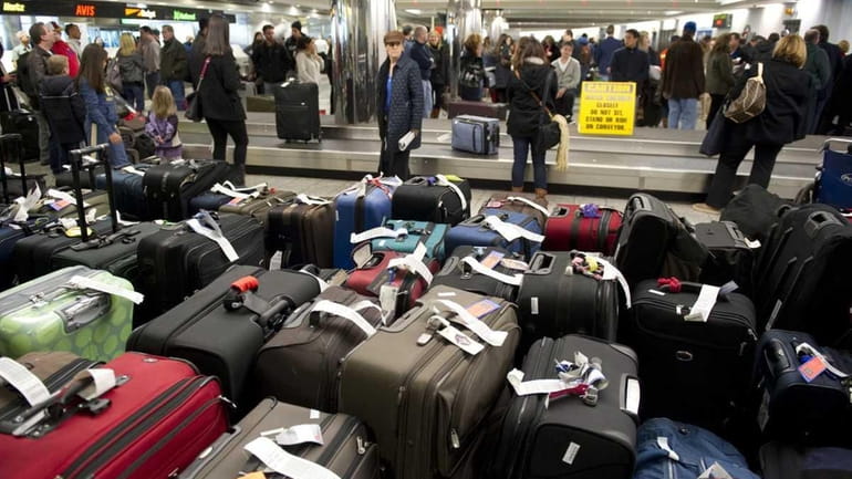Unclaimed bags sit at LaGuardia Airport after a big blizzard...