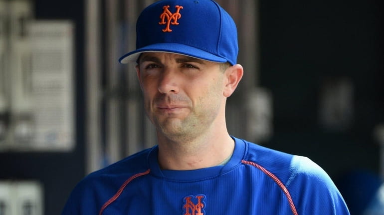 New York Mets' David Wright looks on from the dugout...