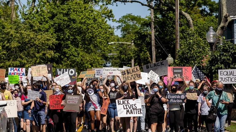 Demonstrators march from Deer Park to Argyle Lake to protest...