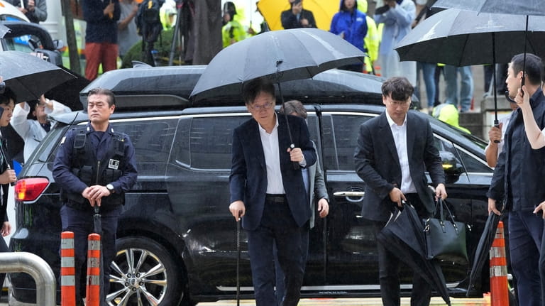 South Korea's main opposition Democratic Party leader Lee Jae-myung, center,...