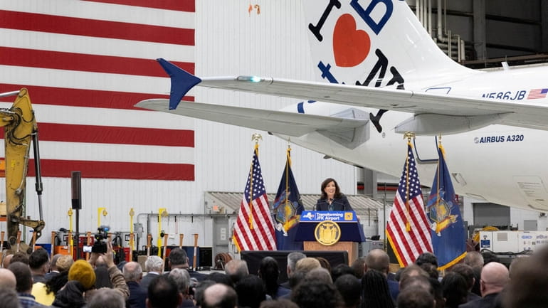 Gov. Kathy Hochul speaks inside a JetBlue hangar at Kennedy Airport during...
