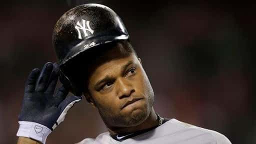 Robinson Cano takes off his helmet after he flied out...