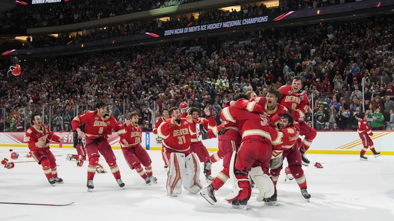 Denver celebrates after defeating Boston College in the Frozen Four...