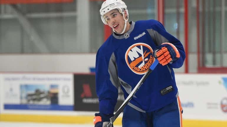New York Islanders defenseman Travis Hamonic looks on during the...