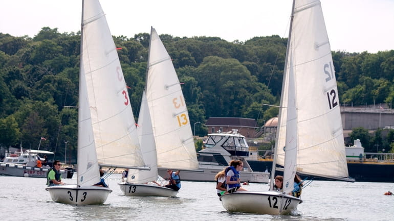 Sailing students make their way around Port Jefferson Harbor during...