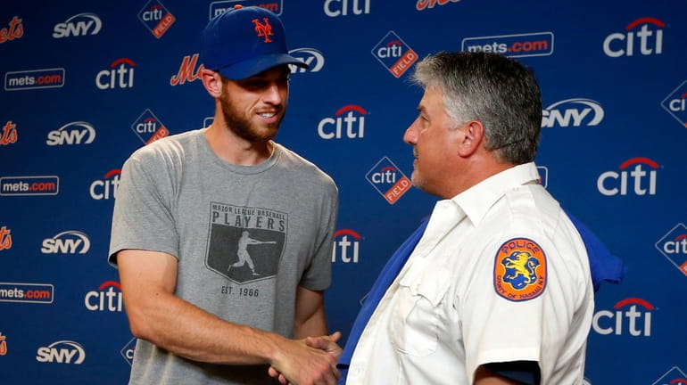 Mets pitcher Steven Matz greets NCPD officer Gaspar Arbisi of...
