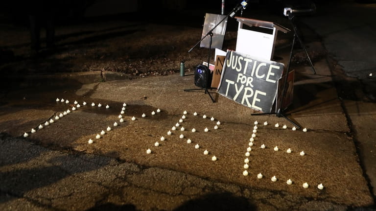 Candles spell out the name of Tyre Nichols during a...