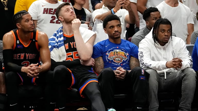 Knicks guard Josh Hart, left, and center Isaiah Hartenstein look...