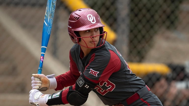 Oklahoma's Tiare Jennings (23) bats during an NCAA college softball...