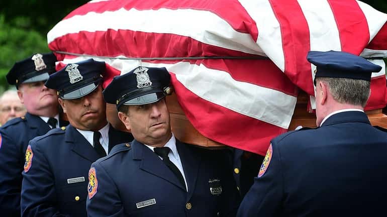 Former Nassau County Executive Francis Purcell's body being carried to...