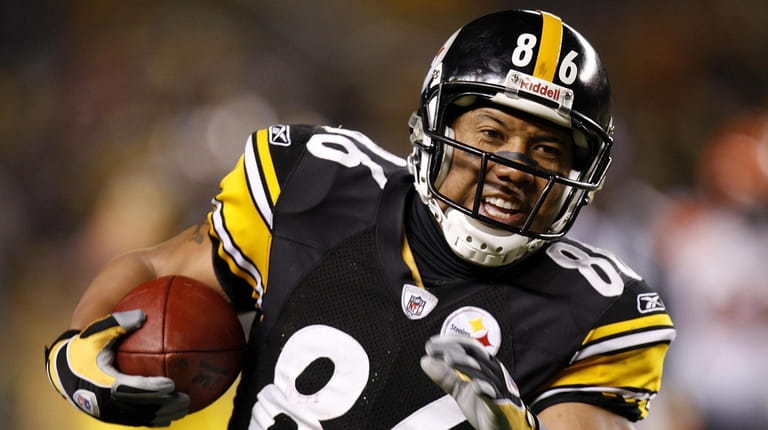 Hines Ward of the Steelers runs after a catch against the...