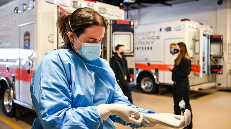 At Sayville Community Ambulance Company, EMT Sunny Ferrara prepares for...
