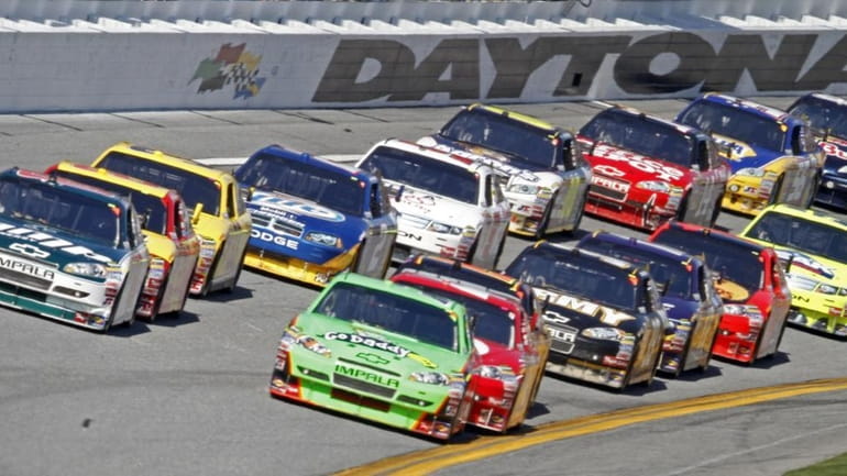 Drivers bring their cars through the tri-oval during the NASCAR...