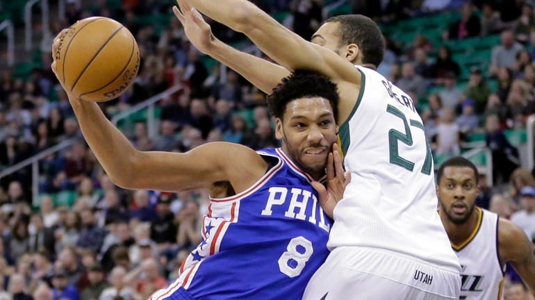 Jahlil Okafor drives to the basket as Jazz center Rudy...