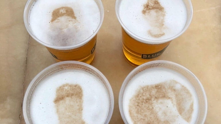 Images of Yankees players are seen in cups of beer...