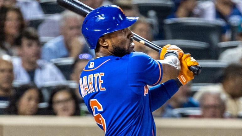 The Mets’ Starling Marte hits a home run in the...