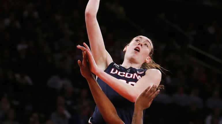 Connecticut's Breanna Stewart, top, goes to the basket against St....