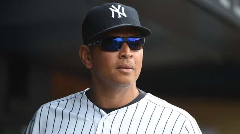 New York Yankees designated hitter Alex Rodriguez looks on from...
