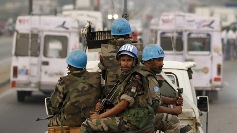 In this file photo, United Nations soldiers from Niger conduct...
