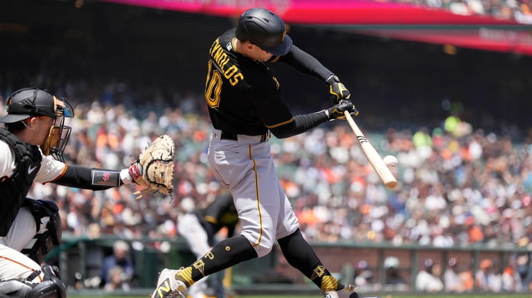 Pittsburgh Pirates' Bryan Reynolds hits a single to drive in...
