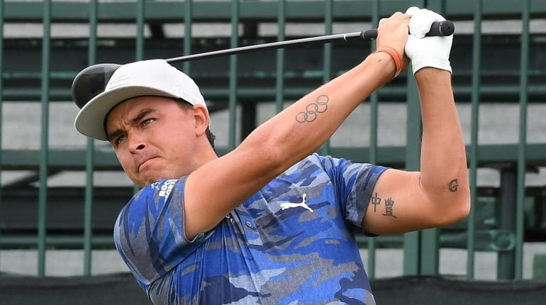 Rickie Fowler tees off on the tenth hole during practice...