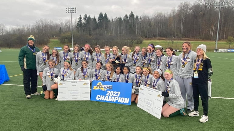 Ward Melville celebrates its second straight girls soccer state championship...