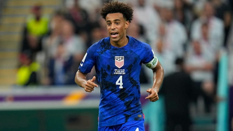 Tyler Adams of the United States runs on the pitch...