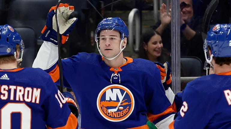 Julien Gauthier #16 of the Islanders celebrates his first period goal...