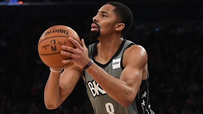 Nets guard Spencer Dinwiddie looks to shoot from the three-point...
