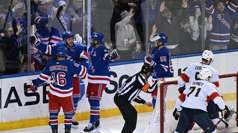 Rangers players celebrate a goal by Jimmy Vesey (26) in...
