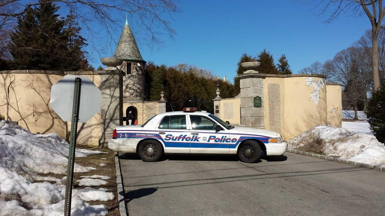 Suffolk County Police block the gate to Oheka Castle Monday,...