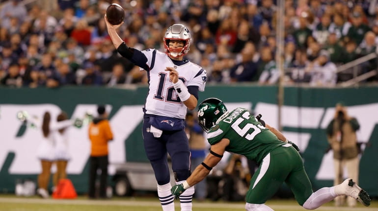 Tom Brady of the New England Patriots throws a pass...