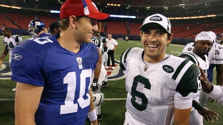FILE - Giants quarterback Eli Manning and Jets counterpart Mark...