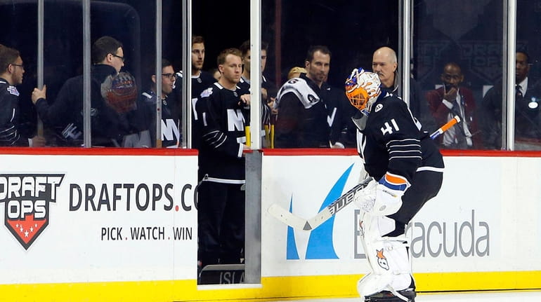 Jaroslav Halak #41 of the New York Islanders leaves a...