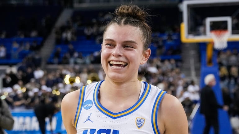 UCLA forward Gabriela Jaquez smiles after the team's victory against...