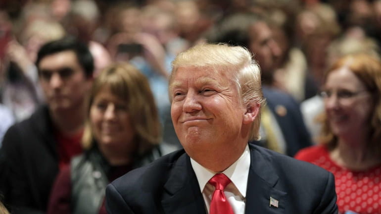 Republican presidential candidate Donald Trump smiles.