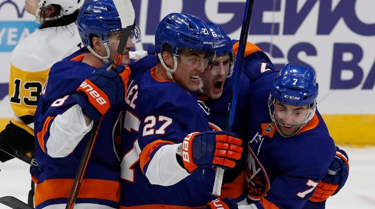 Anders Lee of the New York Islanders celebrates his power...