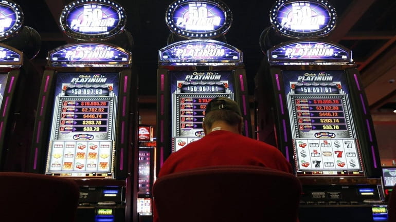 A man plays a video lottery terminal at Saratoga Casino...