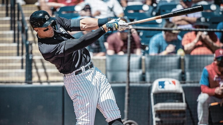 Yankees' Aaron Judge takes a hefty swing in the first inning...