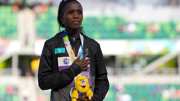 Gold medalist Norah Jeruto, of Kazakhstan, poses during a medal...