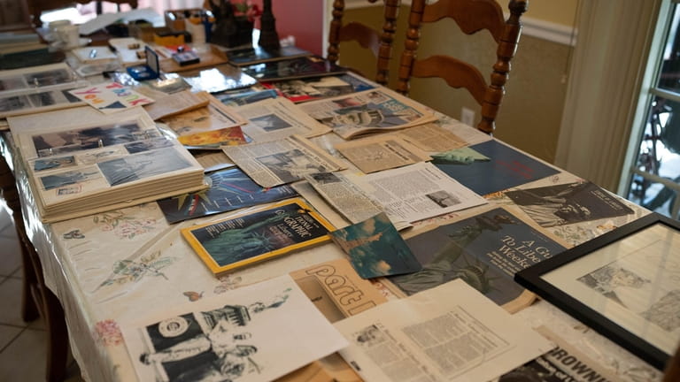 Carol Tuzzolo keeps a collection of newspaper clippings, books and photos of...
