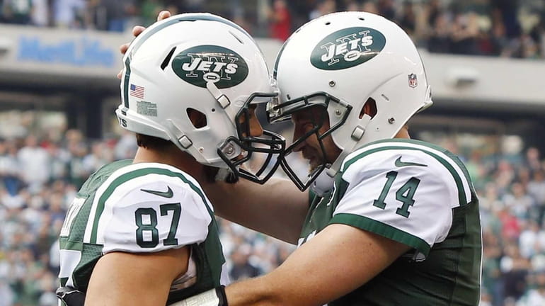 Eric Decker #87 and Ryan Fitzpatrick #14 of the New...