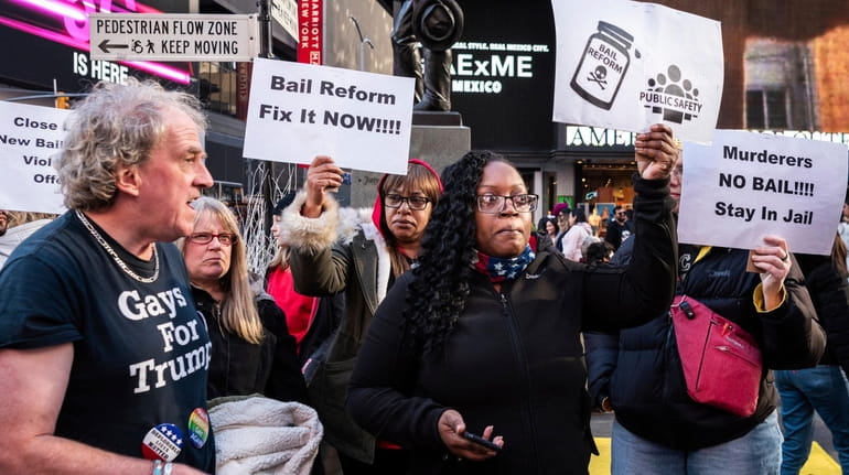 Protesters rally in Times Square against changes in the state's...