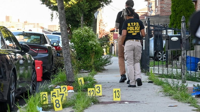 NYPD crime scene investigators work the scene of fatal shooting in...