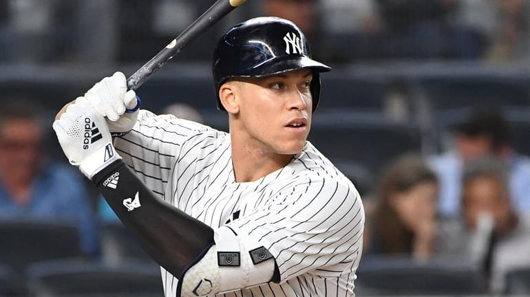 Yankees rightfielder Aaron Judge looks for his pitch against the Red...