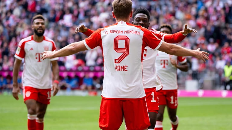 Harry Kane of Munich celebrates scoring his side's second goal...