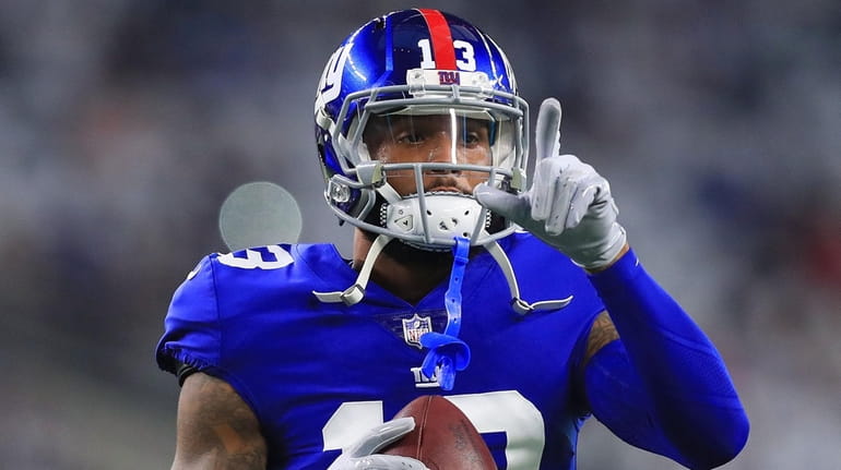 Giants wide receiver Odell Beckham Jr. points to a first...