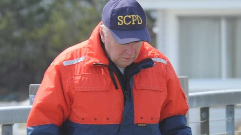 Suffolk County police marine units collect potential evidence near Oak...