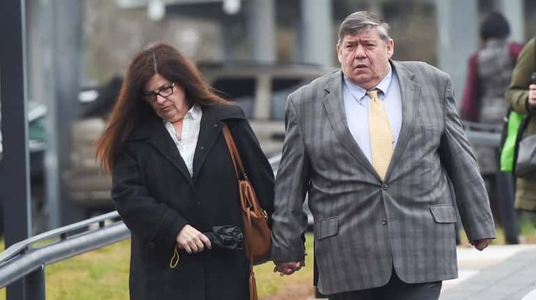 Thomas Murphy and his wife, arrive at Suffolk County Court...